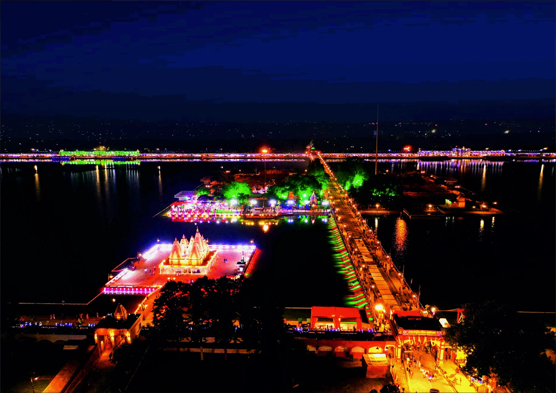 Brahma Sarovar illuminated at night during the celebration